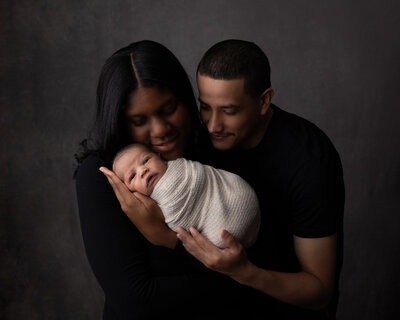 Pittsburg family poses with son in arms for their studio session in Greensburg
