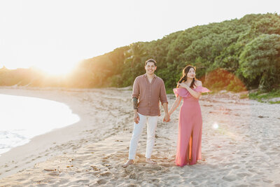 couple hand in hand on beach
