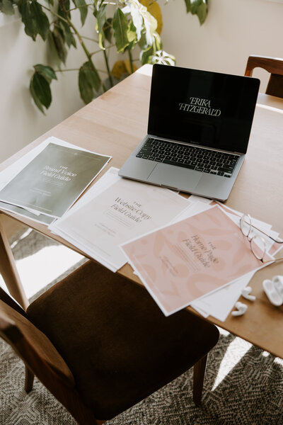 Website copywriting templates and a laptop on a table