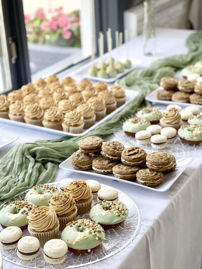 sage green desserts table