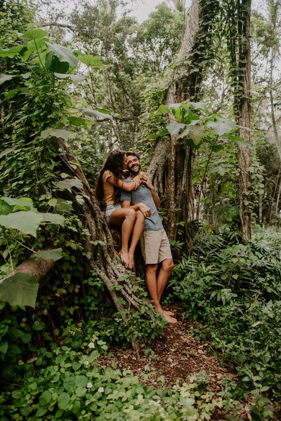 man and woman standing in jungle