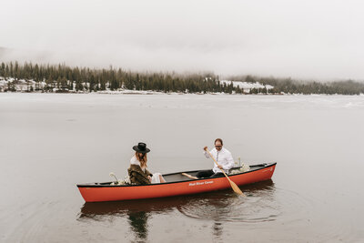 A couple canoes during their elopement in Montana.