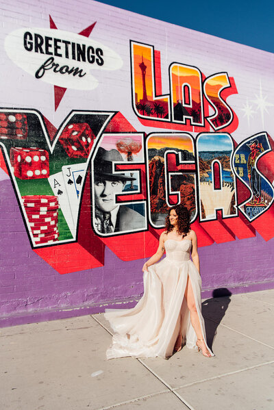 A bride swinging out one side of her dress.