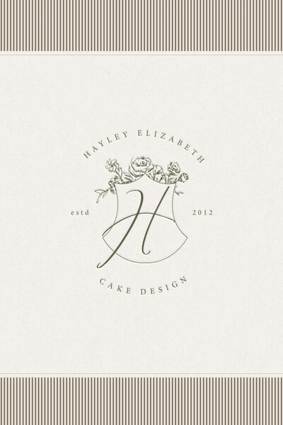 Hand-sketched floral crest as part of a refined brand identity for a premium creative business.
