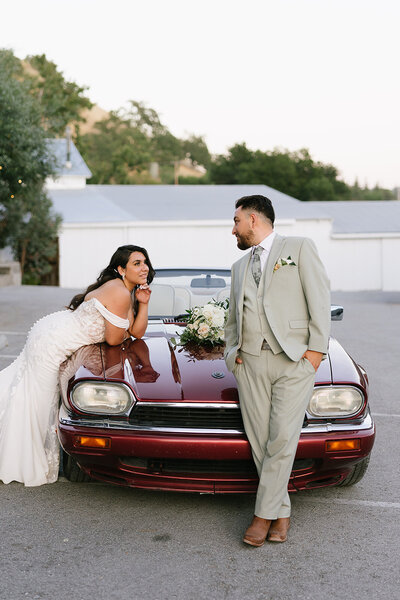 Bride and groom at black tie wedding while holding hand at garre vineyard in livermore 