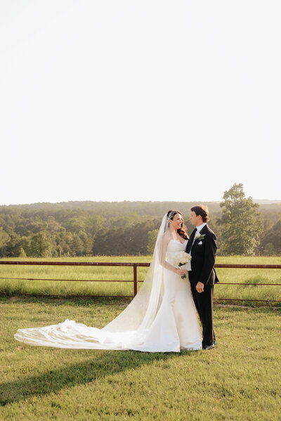 Bride and Groom walking to reception on their wedding day in Tyler, TX