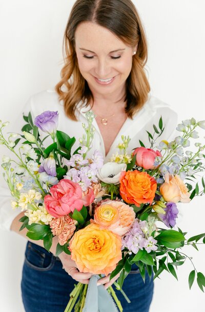 Davidson Flower Co ownder holding signature bouquet