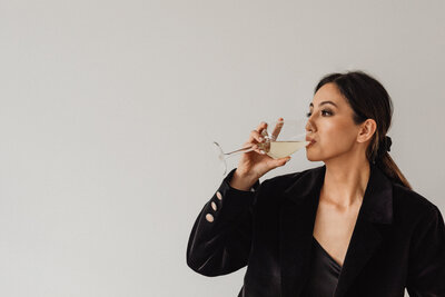 kaboompics_sophisticated-wine-tasting-portraits-modern-asian-woman-in-elegant-black-outfit-holding-white-wine-glass-33693