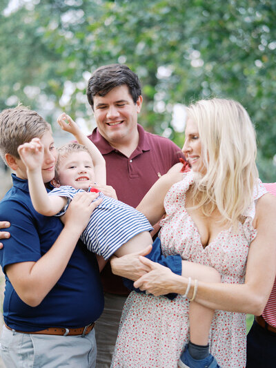 A family playing with a toddler at a Richmond mini session by Katie Stansfield Photography.