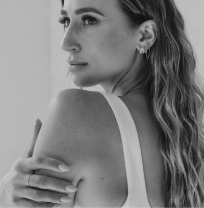 Woman hugging herself