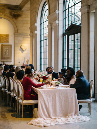 Wedding ceremony with ghost chairs and fall ground florals in style of growing garden