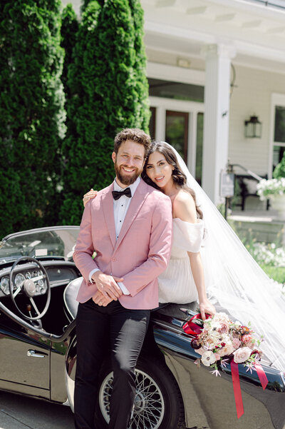 Stylish couple doing a wedding exit in a vintage car in Franklin Tennessee