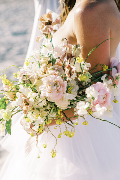 Close up image of a bride's bouquet on the beach