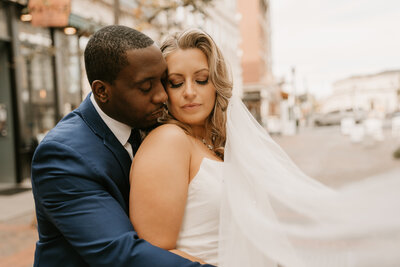 bride and groom holding hands