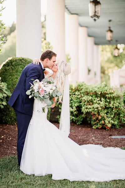 Bride and groom kissing by Knoxville Wedding Photographer, Amanda May Photos