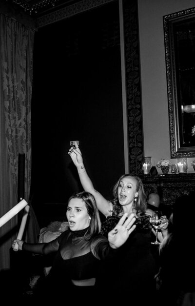 Bride standing by London taxi