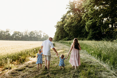 small family smiling at the camera