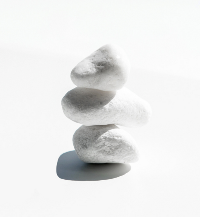 Rocks stacked with a white background