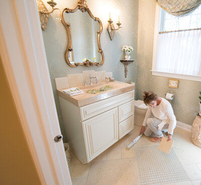 Interior designer looks at swatches in new bathroom design