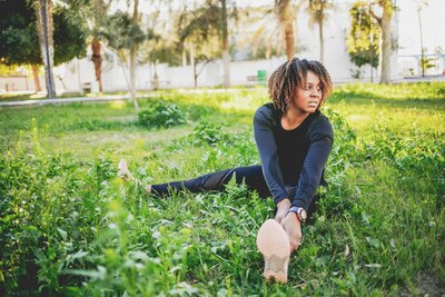 Woman stretching outside in the grass