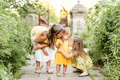 Three young sisters at Fabyan Forest Preserve by Chicago family photographer.