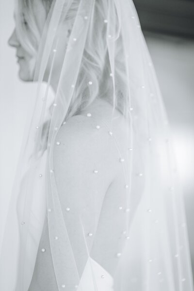 Bride hide under pearl veil