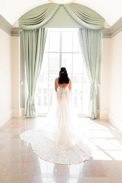 Elegant bridal portrait captured by Style & Grace Photography in St. Louis, MO, featuring the bride in a stunning lace wedding dress, highlighting her beauty and grace on her special day.