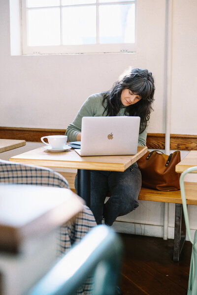 Bloem Creations founder Carrie works in a coffee shop.