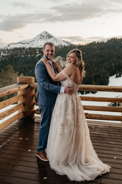 A couple dances on a patio in Big Sky Montana during their elopement.