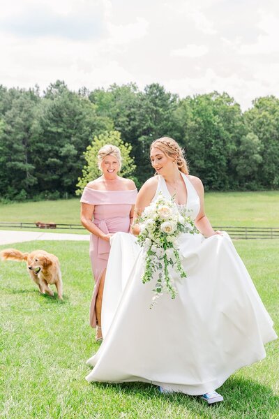 Bride walking with her mother and dog