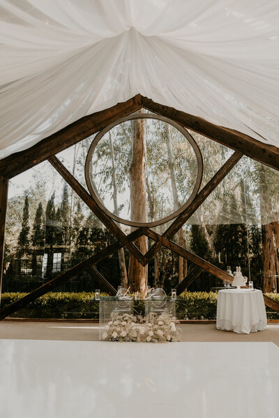 Lauren and Christian’s elegant wedding reception with draping and chandeliers, designed by Beyond the Event and photographed by Kellie Jane Photography.”