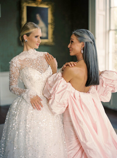 Bride and Mother of the bride wearing a pink ballgown