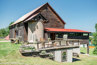Rustic barn exterior with a red roof