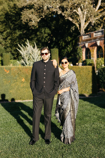 woman wearing sari and man wearing traditional indian suit during engagement session at filoli estate