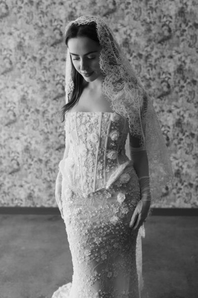 bride wearing lace form fitting wedding dress