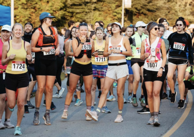 A group of women runners excited to start a half marathon