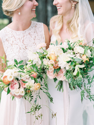 a bride with her maid of honor at vista hills vineyard in oregon