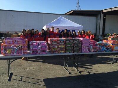 JOY volunteers with toy donations
