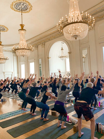 100 yoga students at event in grand victorian hall