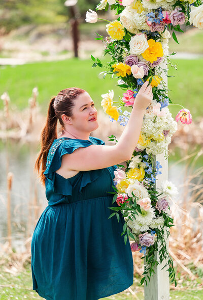 Photo of Beth arranging flowers