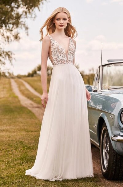 Mikaella Duchesse Satin Wedding Dress. Mikaella Duchesse Satin gown with scoop neckline and straps at back. Beaded belt at waist. Fit and flare skirt.