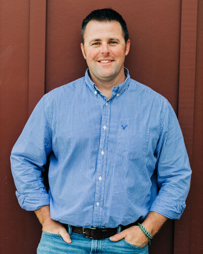 Headshot of Kevin Conklin against red background