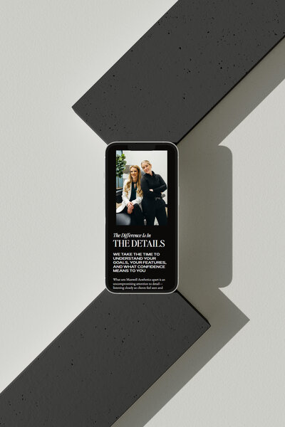 Minimalist mobile design featuring brand messaging and mobile-optimized layout by Ruby Works Co.™, shot on soft gray pedestal.