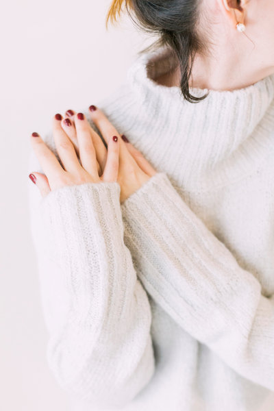 Canva - Woman Wearing Turtleneck Sweater in White Surface