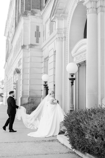 bride and groom walking into wedding venue at ohio wedding day
