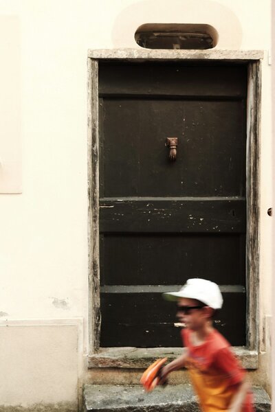 Boy running in Europe town