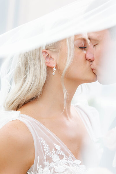 bright light and airy wedding photo of bride  and groom