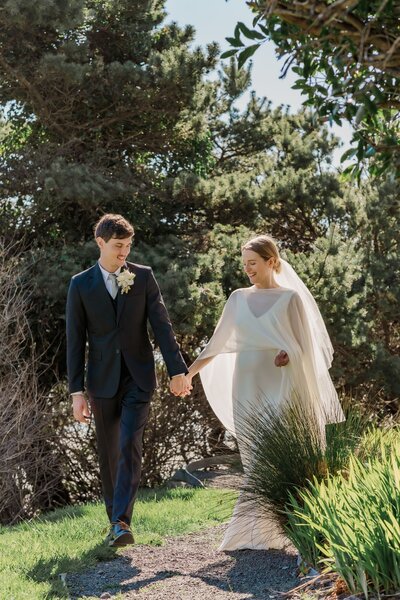 Bride and groom walk together after wedding