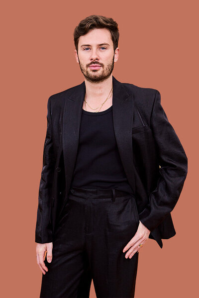 Jordan, Sydney Salon Owner & hairdresser with a warm smile, showcasing expertise in a modern salon