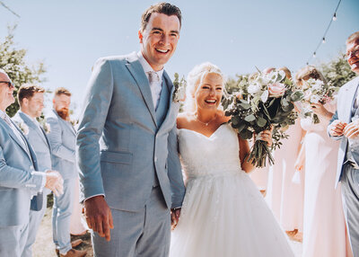 Bride and groom first look photos in field